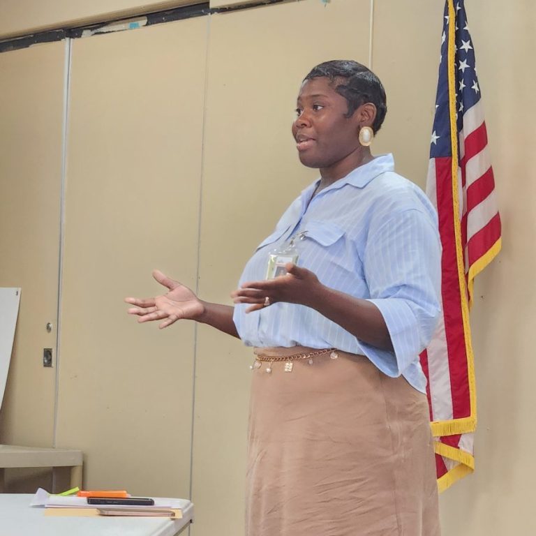 Maegan Williams Pope, an infant and early childhood mental health consultant with the Alabama Department of Mental Health, speaks to attendees at the Children’s Policy Council meeting about services provided through the agency. Photo by Christa Jennings